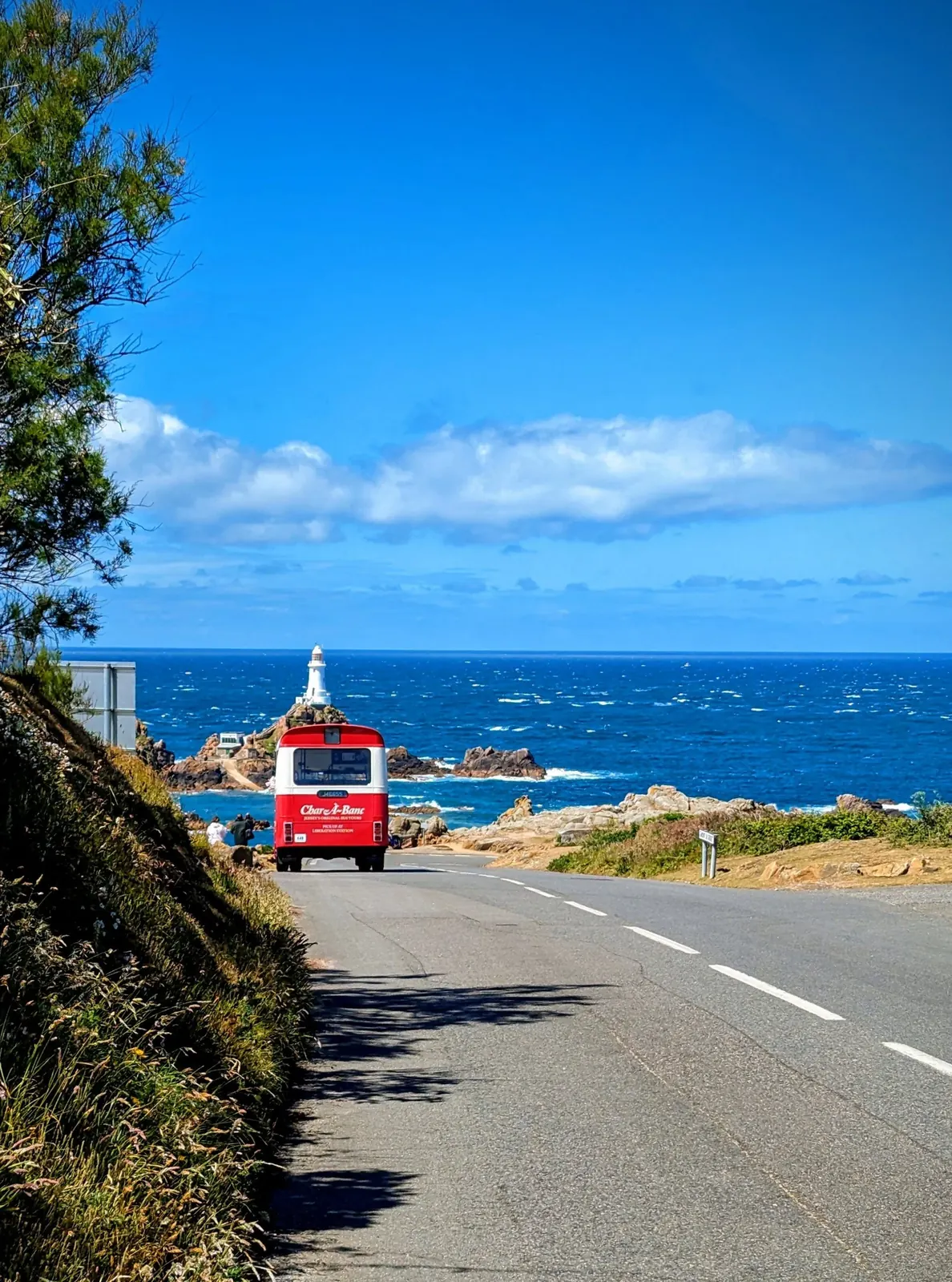 Open-top bus on the Jersey coast road
